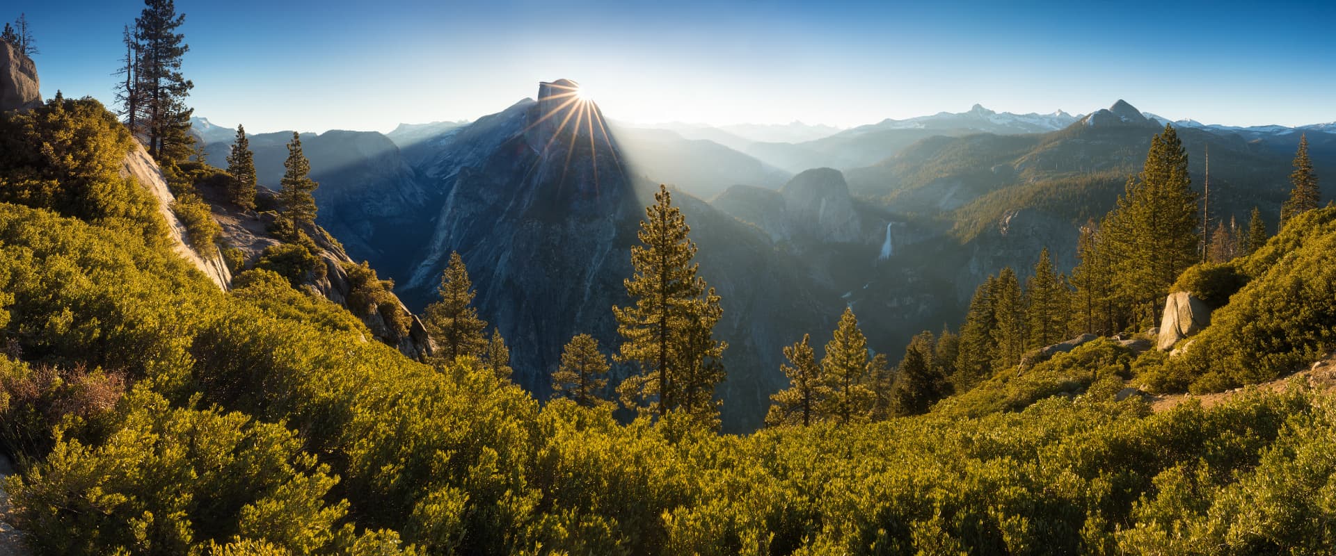 Mountain ridges and forested valley at sunrise